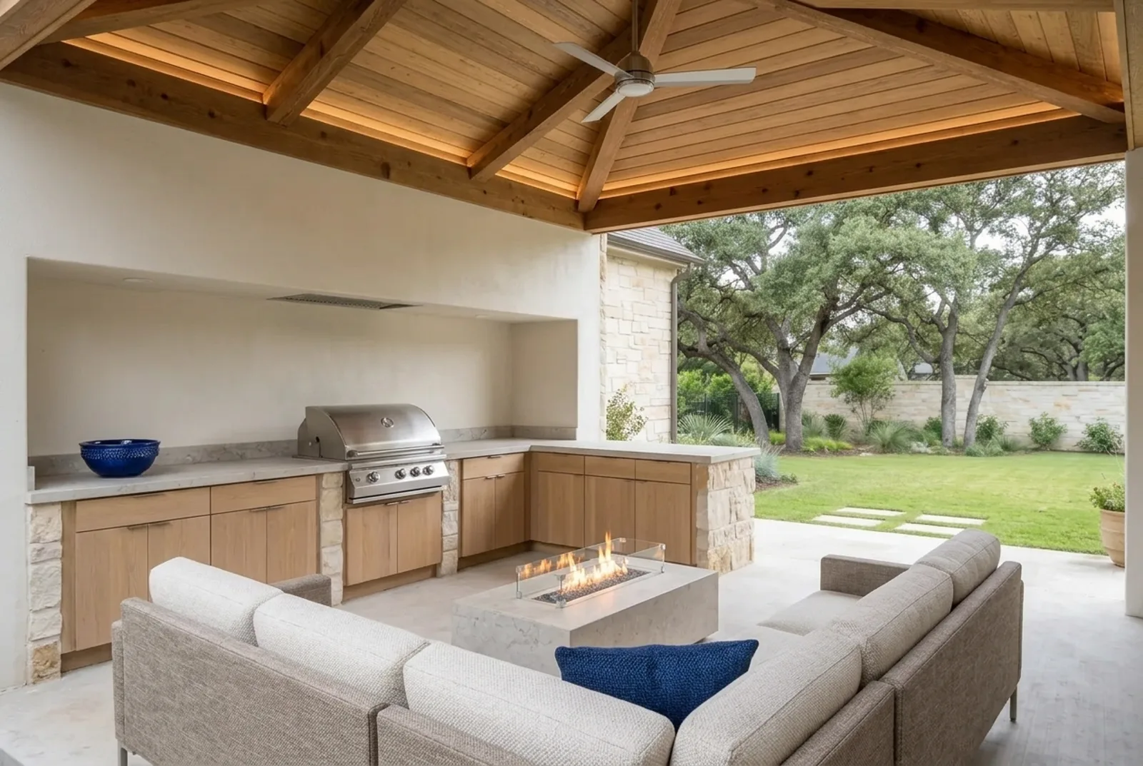 The same patio after the renovation: a cedar ceiling, outdoor kitchen and fire table (concept rendering)